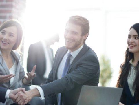 Successful partnership in business displayed by shaking hand